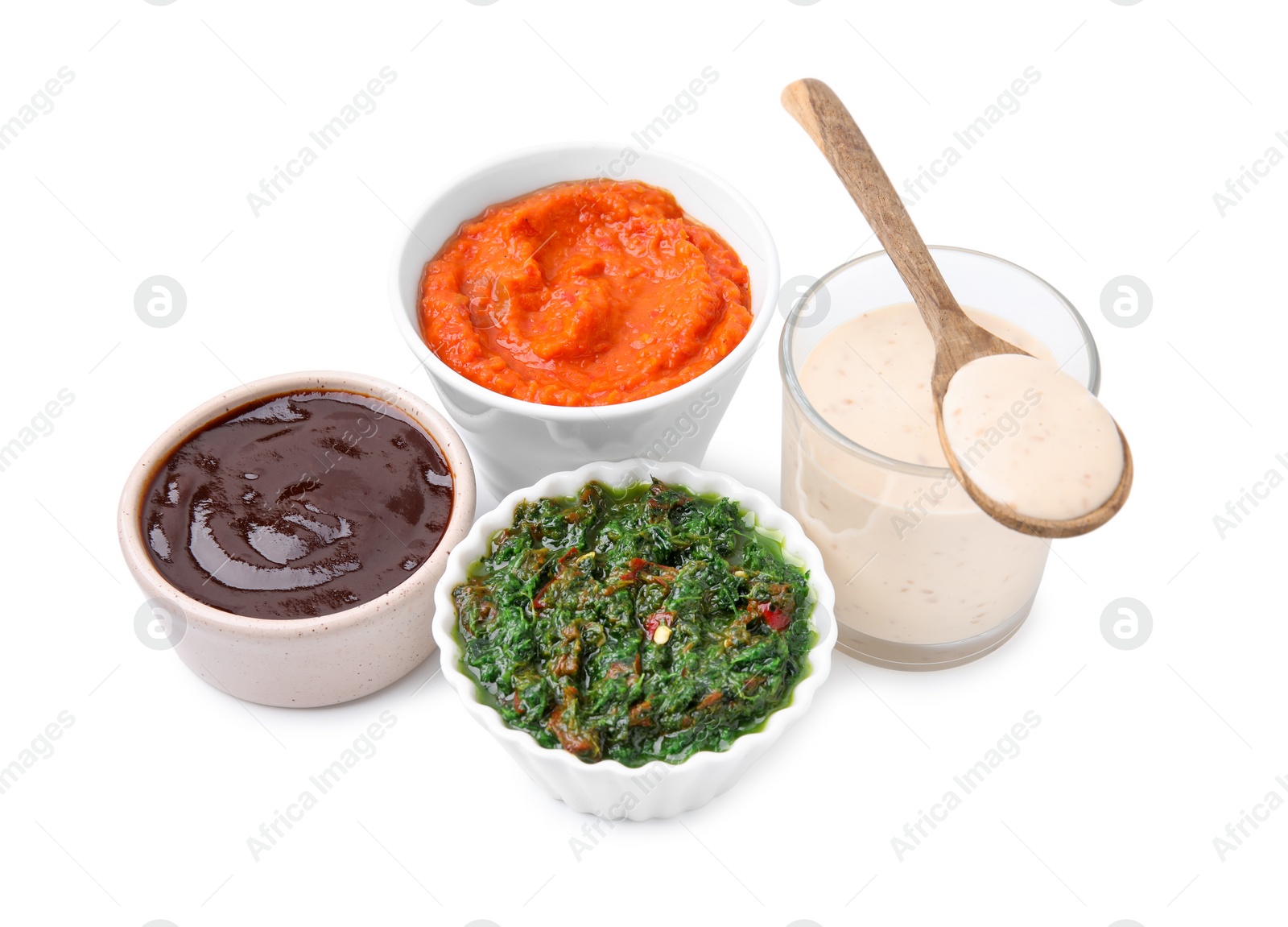 Photo of Different marinades in tableware isolated on white