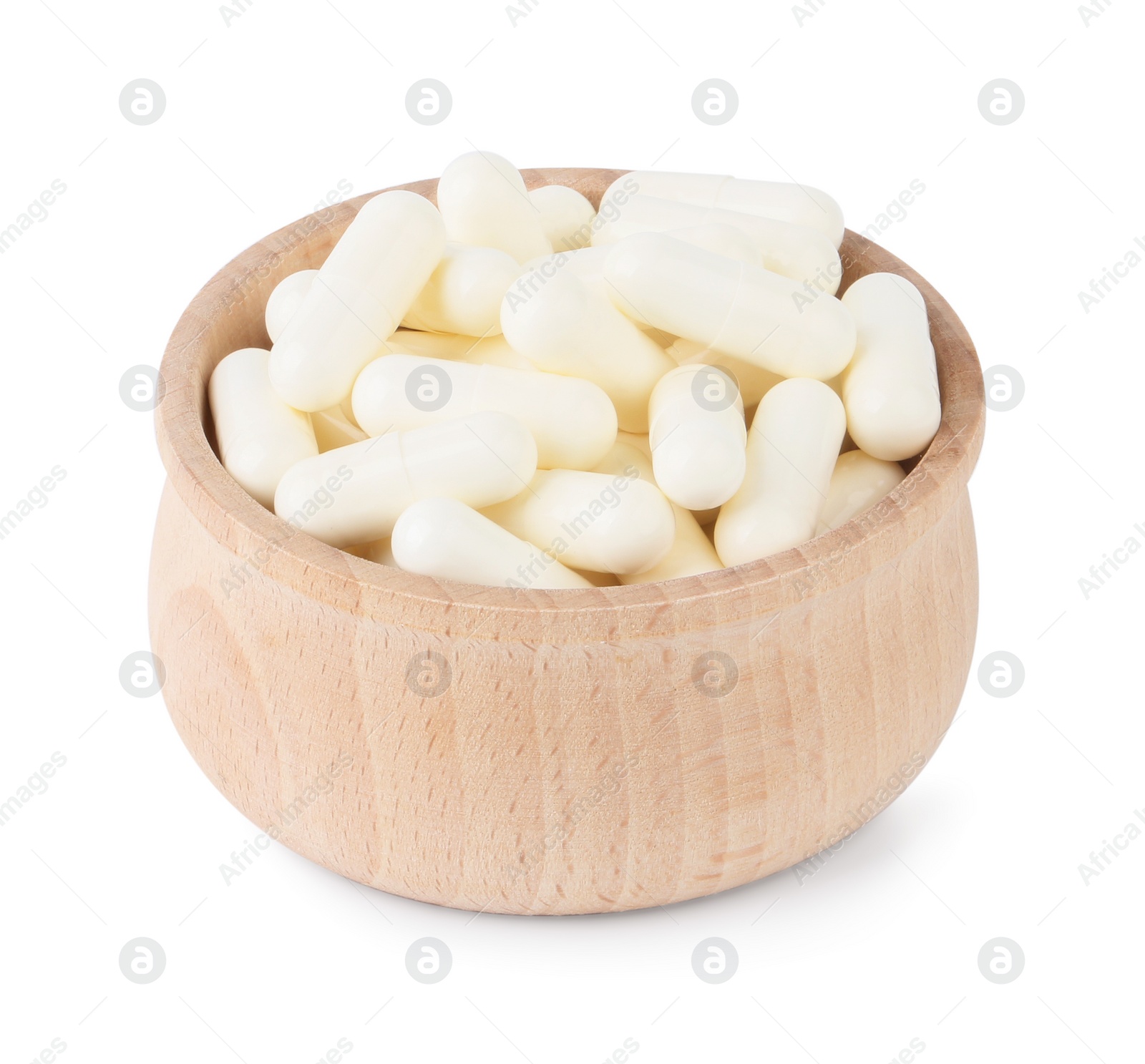 Photo of Vitamin capsules in wooden bowl isolated on white