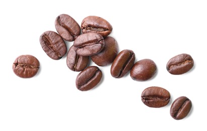 Photo of Many roasted coffee beans isolated on white, top view