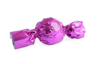 Photo of Tasty candy in violet wrapper isolated on white