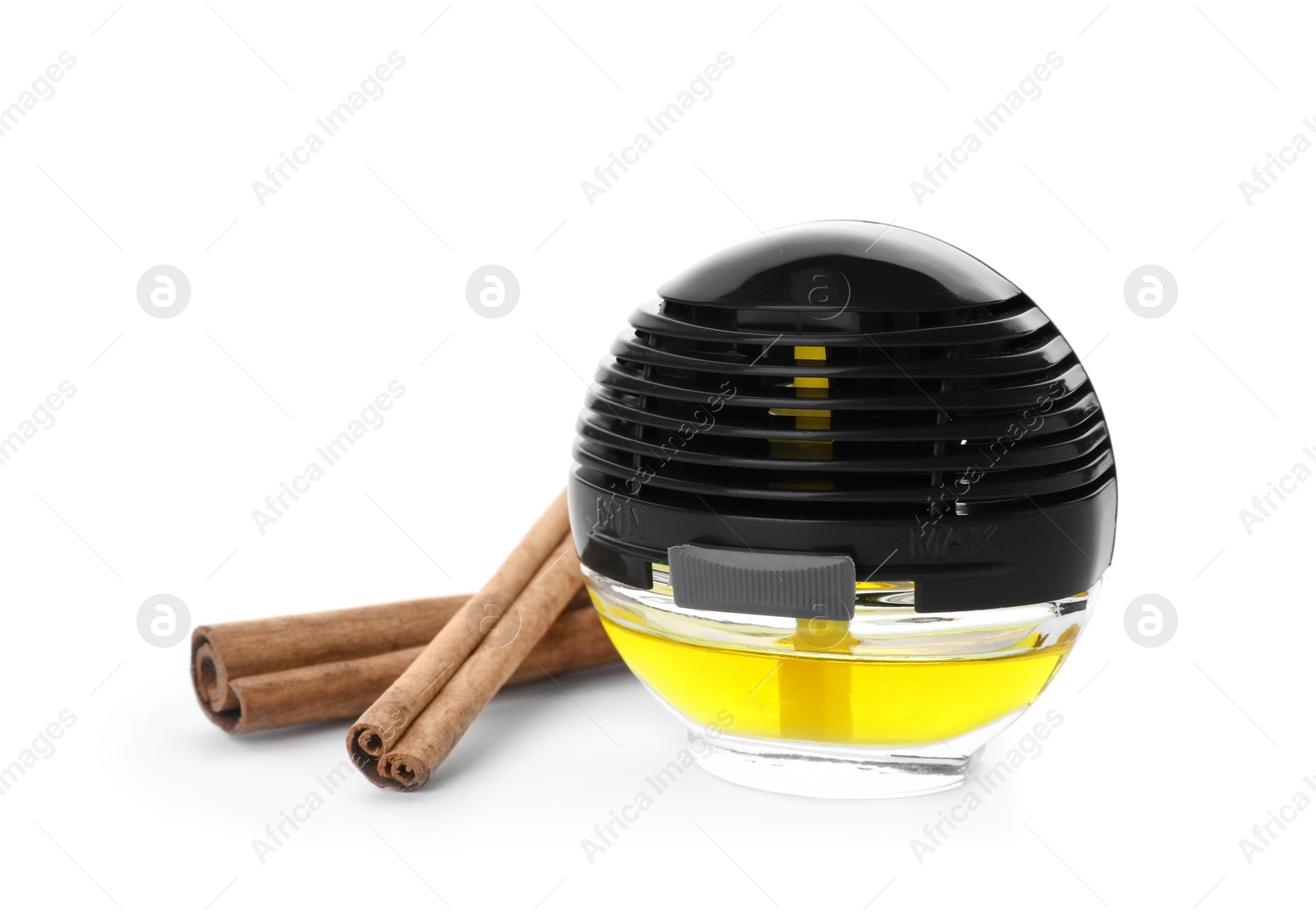 Photo of Car air freshener and cinnamon sticks on white background