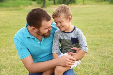 Man with his child outdoors. Happy family