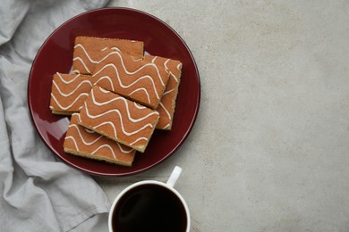 Photo of Tasty sponge cakes and hot drink on light grey table, flat lay. Space for text