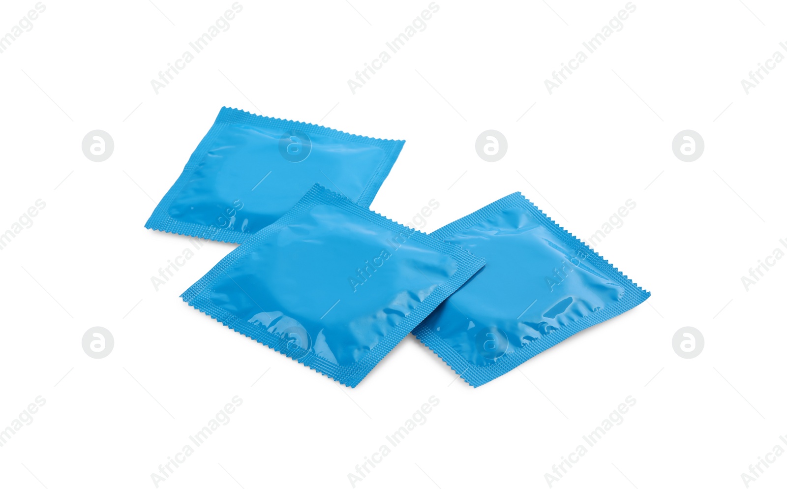 Photo of Condom packages isolated on white. Safe sex