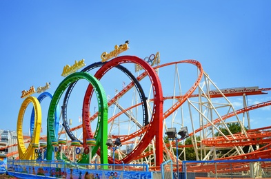 Photo of VIENNA, AUSTRIA - JUNE 18, 2018: Olympia Looping roller coaster in amusement park on sunny day