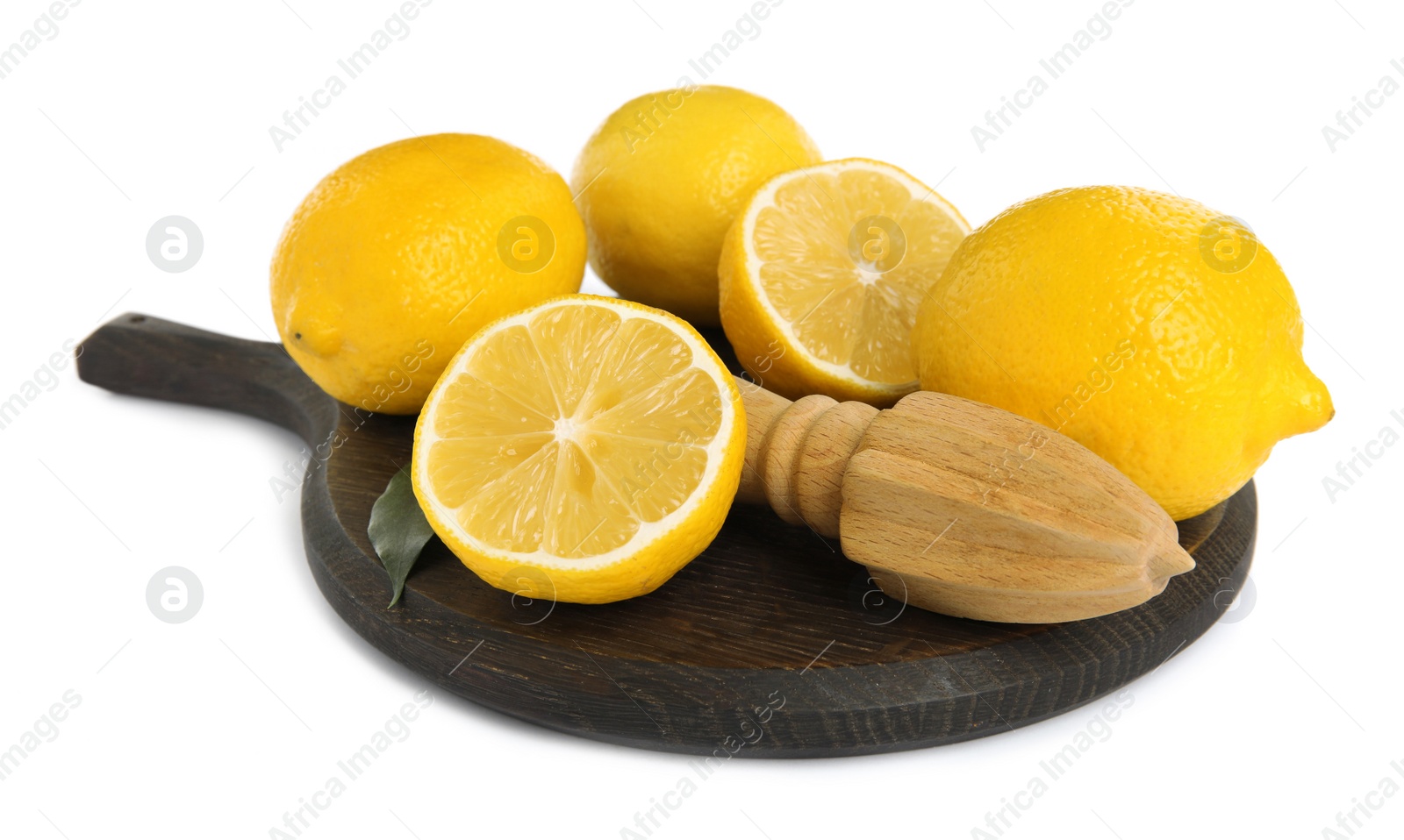 Photo of Wooden citrus reamer and fresh lemons on white background