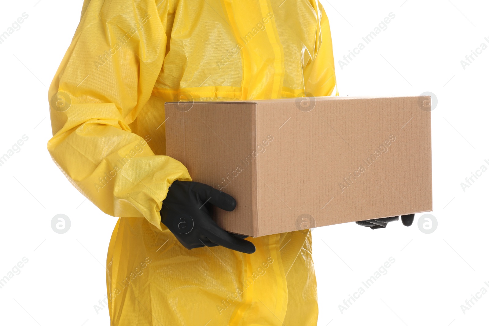 Photo of Man wearing chemical protective suit with cardboard box on white background, closeup. Prevention of virus spread