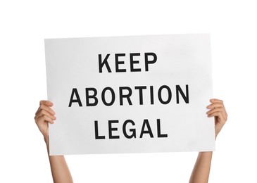 Image of Woman holding placard with phrase Keep Abortion Legal on white background, closeup. Abortion protest