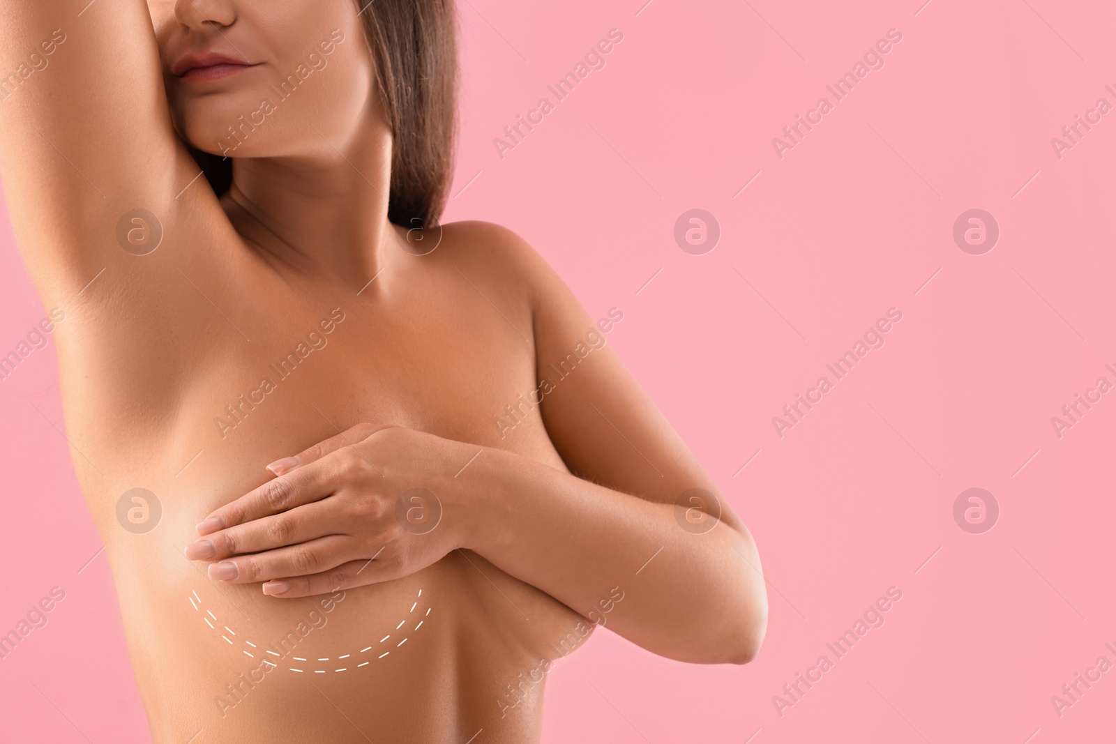 Image of Breast augmentation. Woman with marking for plastic surgery on skin against pink background, closeup. Space for text