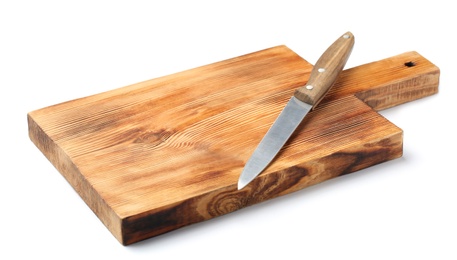 Photo of Utility knife and wooden board isolated on white