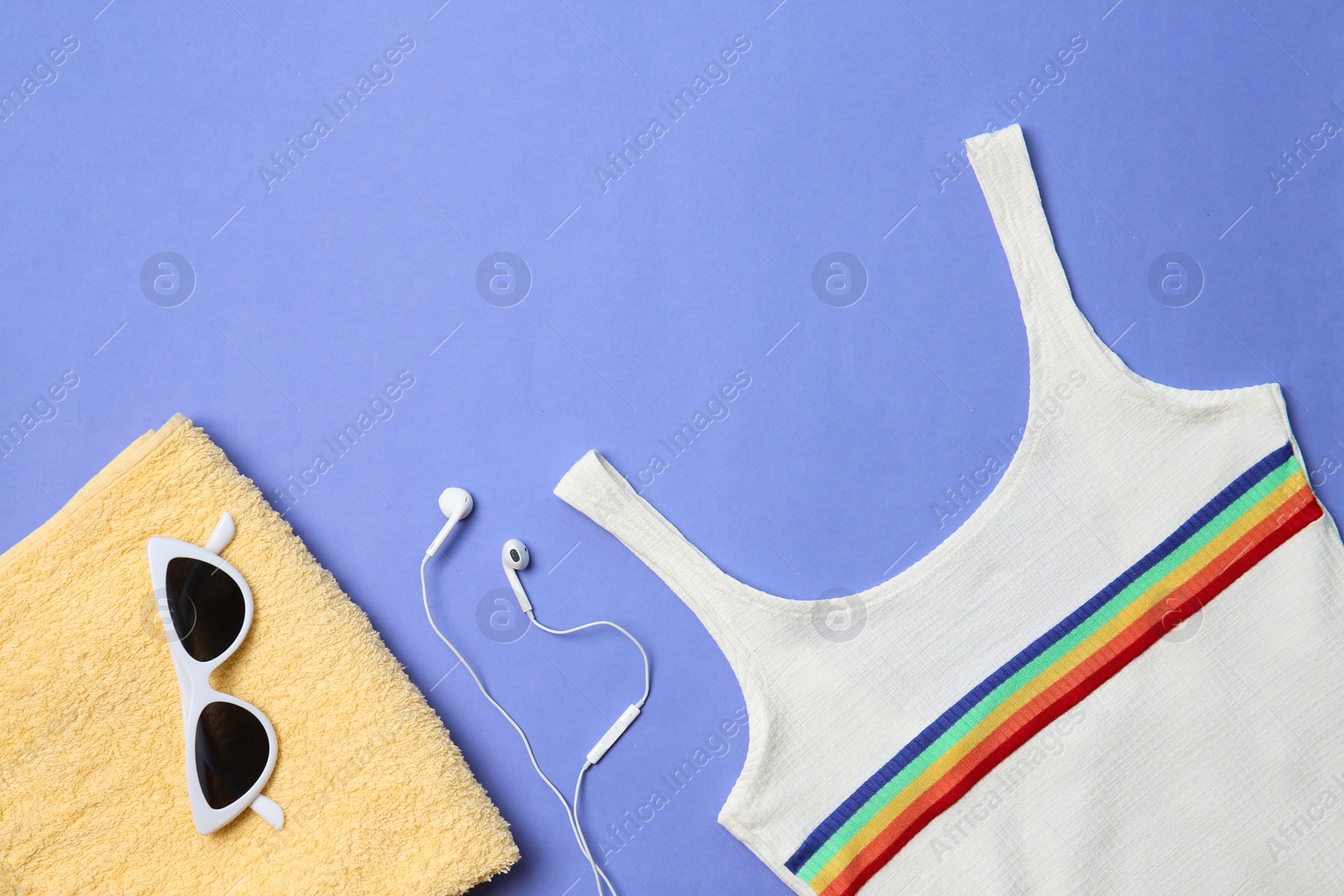 Photo of Flat lay composition with headphones and beach objects on color background