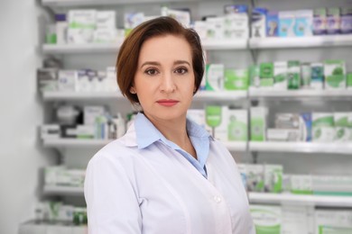 Photo of Portrait of professional pharmacist in modern drugstore