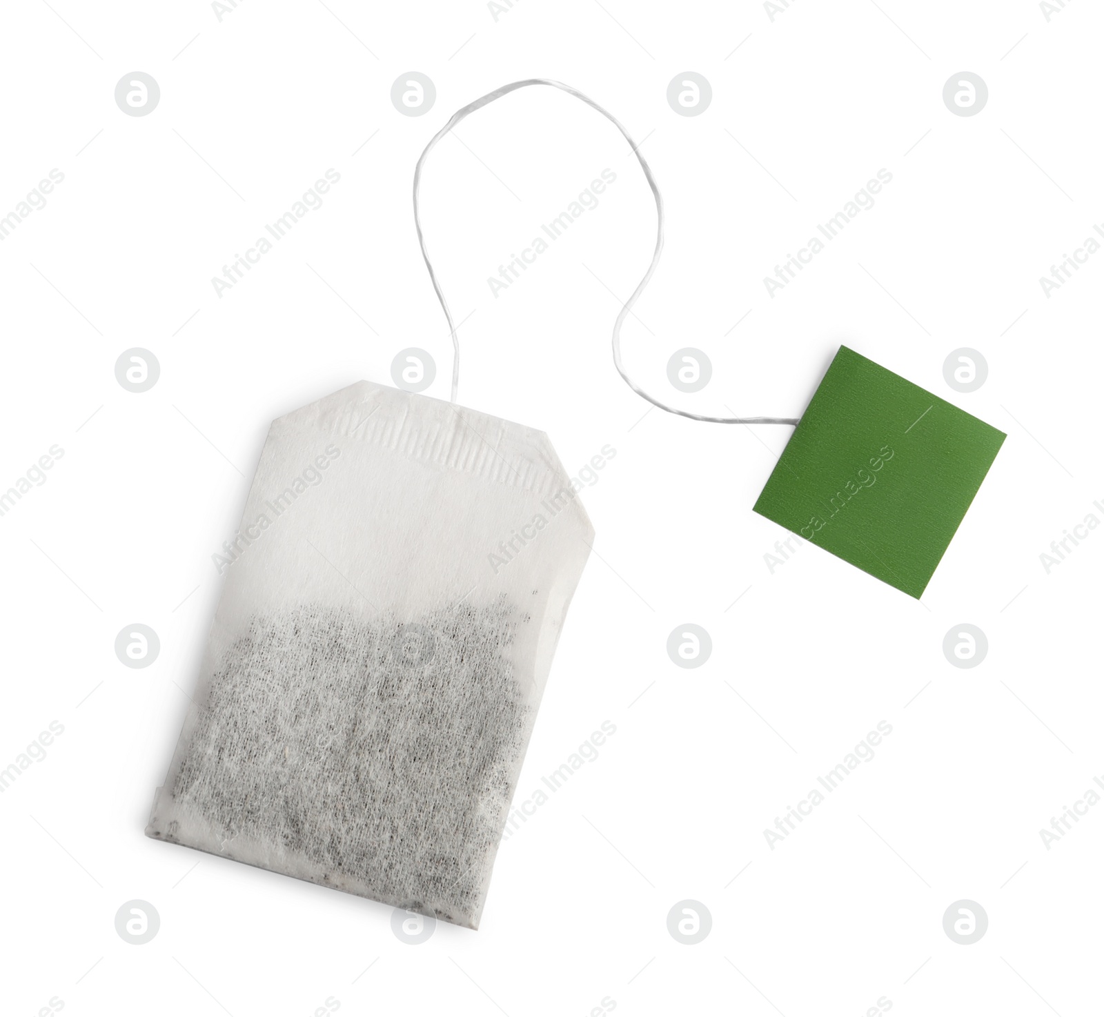 Photo of Paper tea bag with tag isolated on white, top view