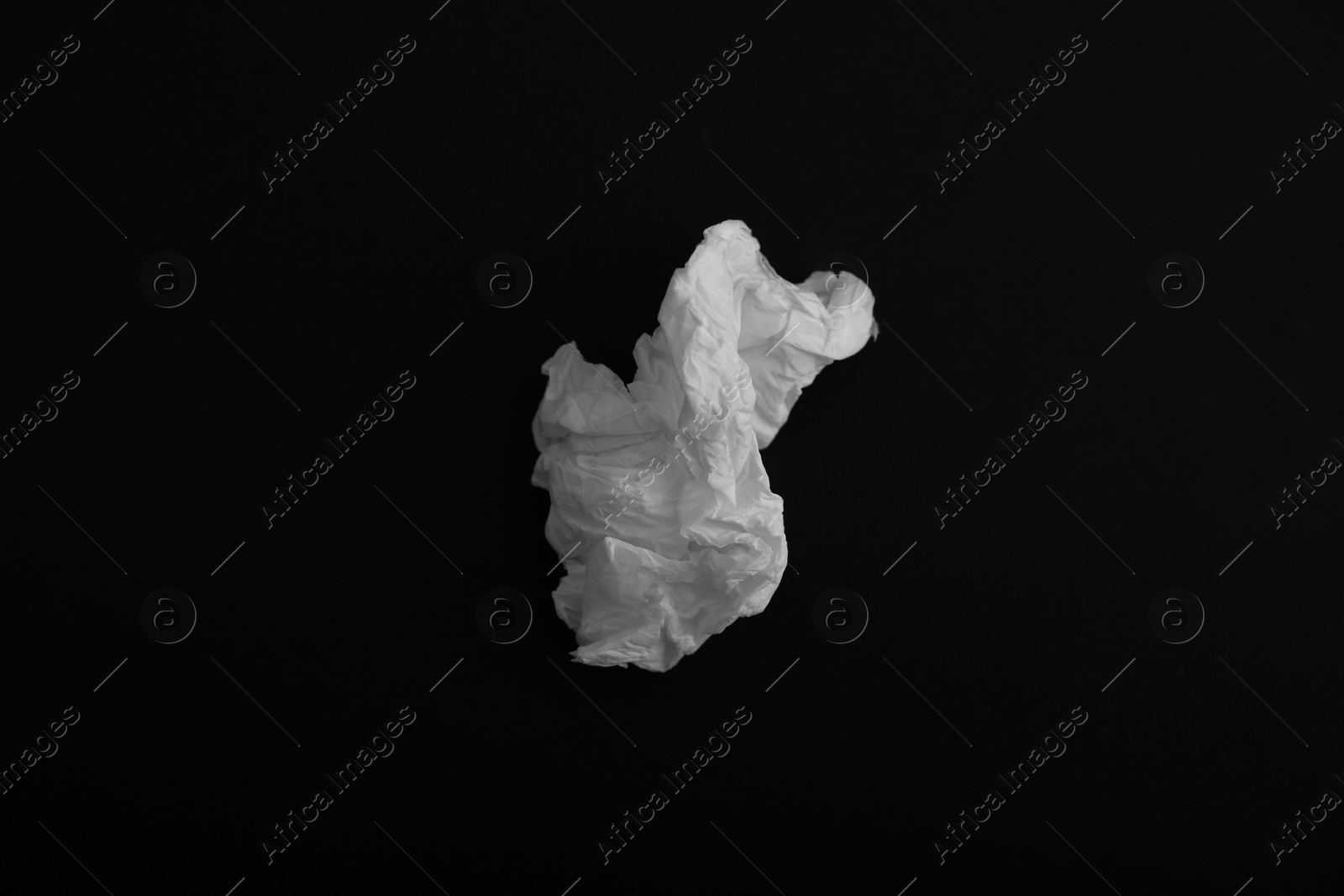 Photo of Used paper tissue on black background, top view