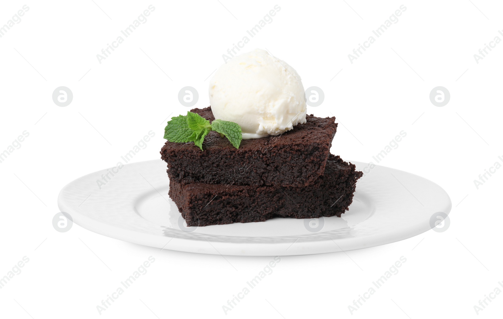 Photo of Tasty brownies with ice cream and mint isolated on white