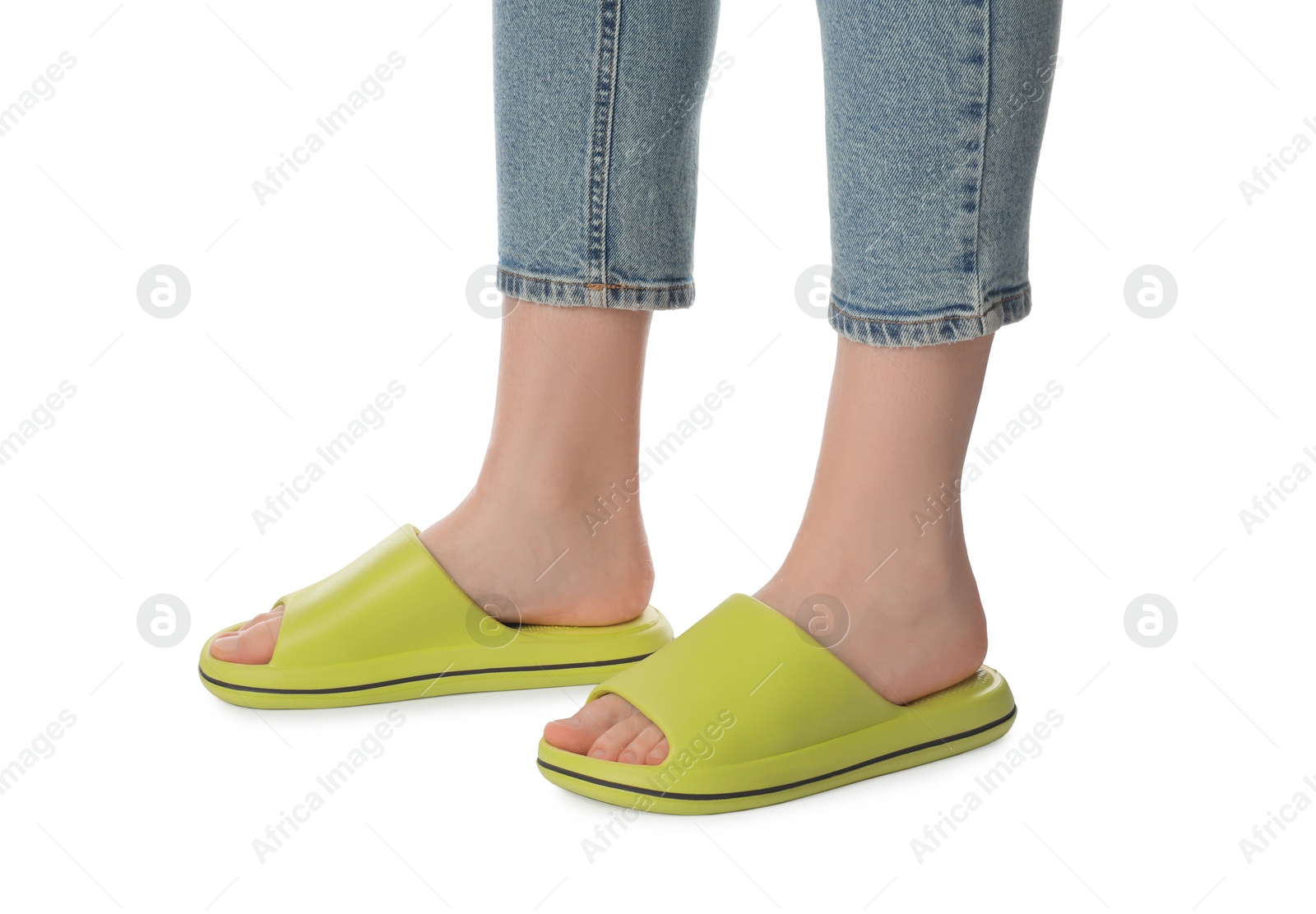 Photo of Woman in green slippers on white background, closeup