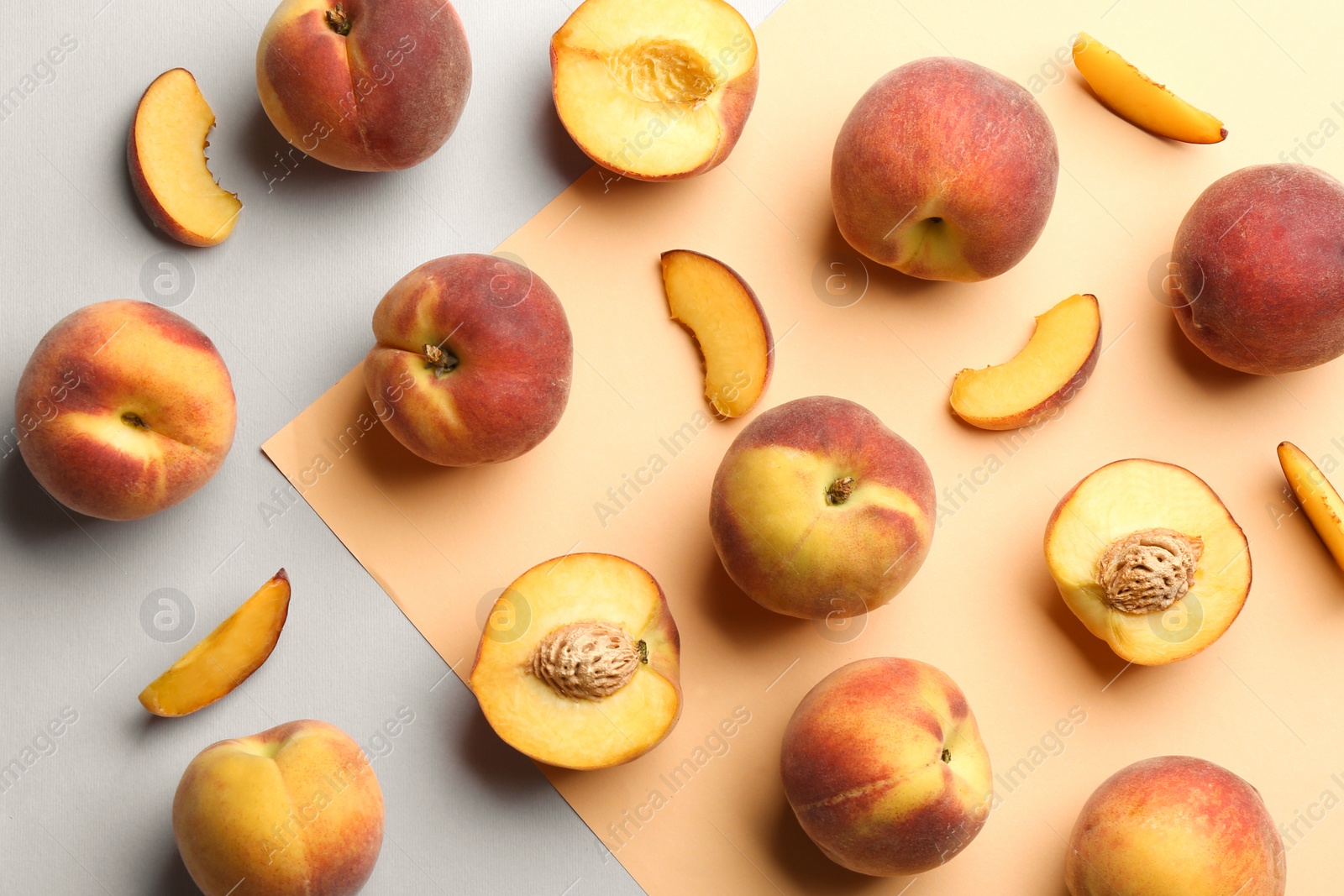 Photo of Flat lay composition with fresh peaches on color background