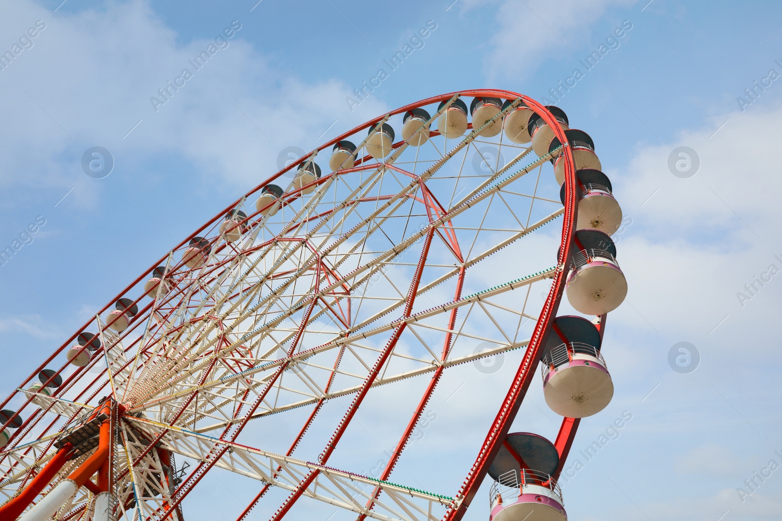 Photo of Beautiful large Ferris wheel outdoors, low angle view