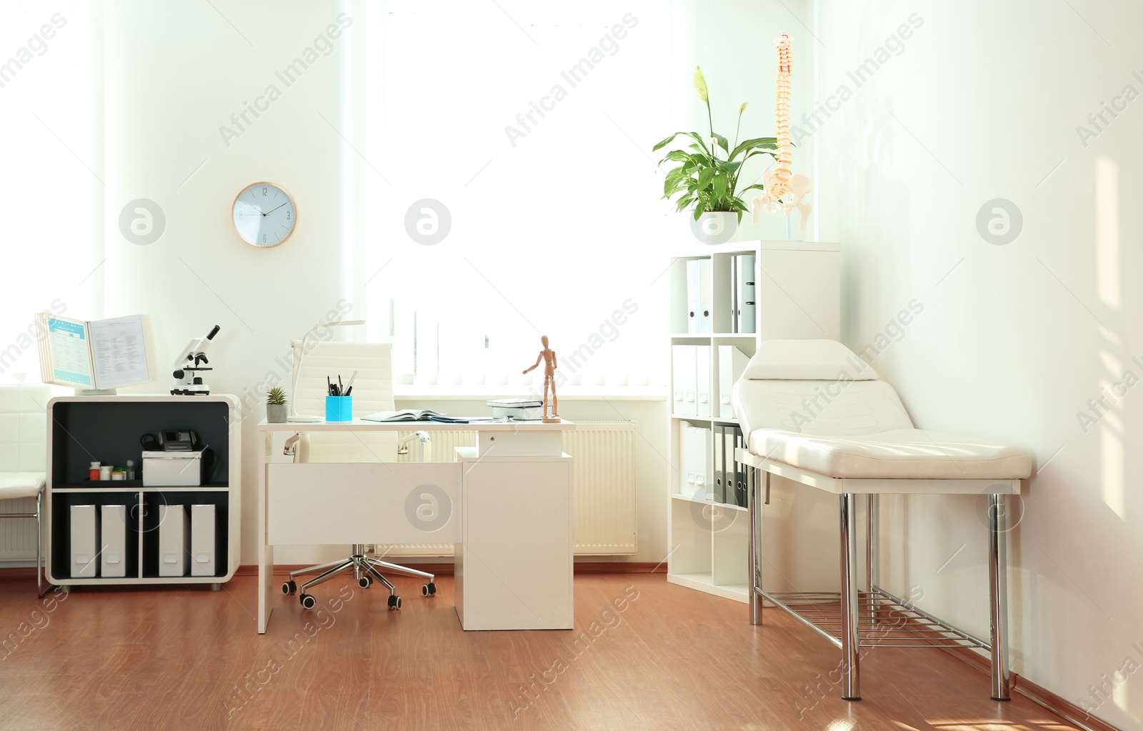 Photo of Interior of modern medical office. Doctor's workplace