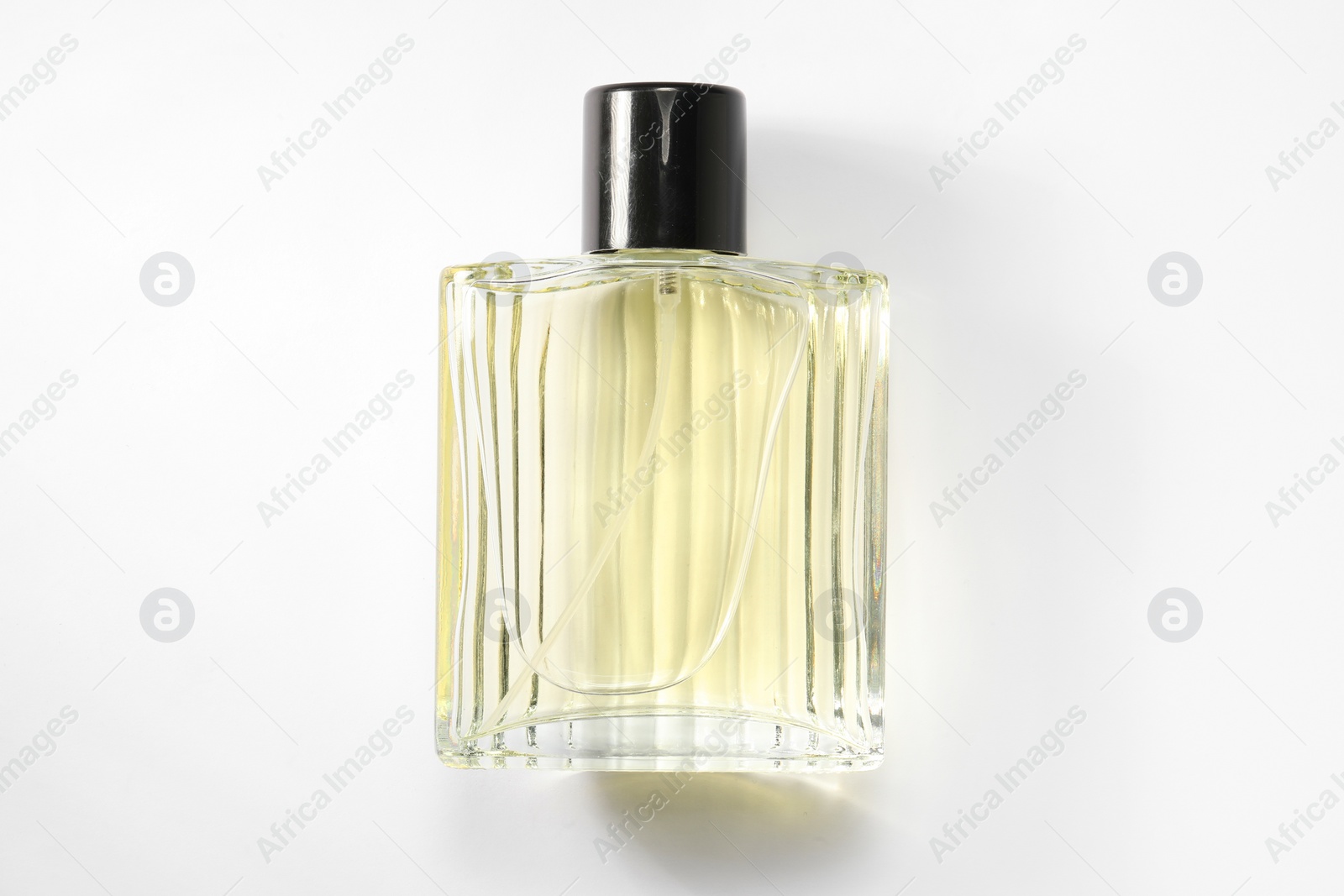 Photo of Luxury men`s perfume in bottle on white background, top view