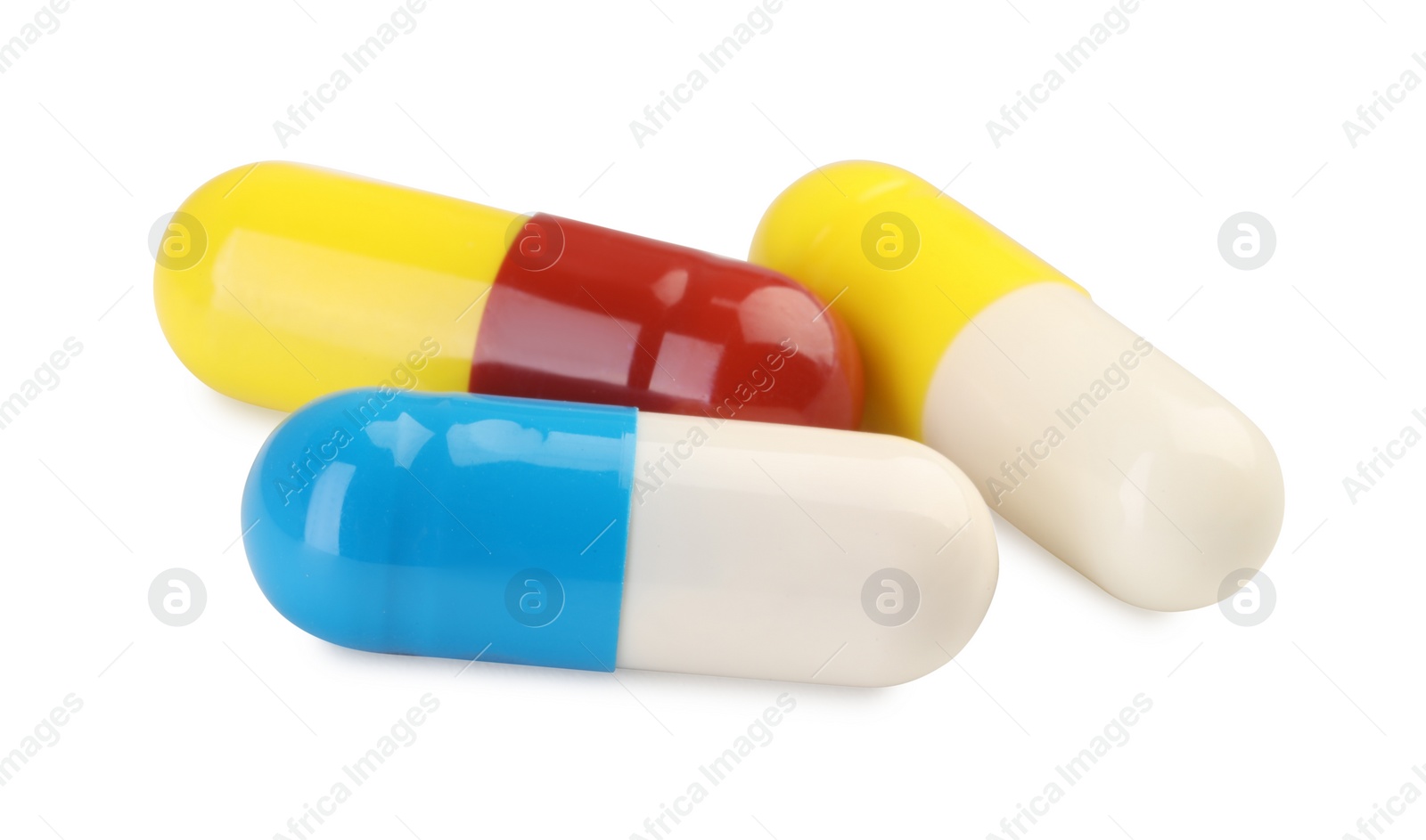 Photo of Three antibiotic pills isolated on white. Medicinal treatment