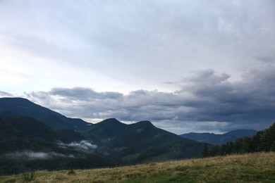 Photo of Picturesque viewcloudy sky over majestic mountain landscape