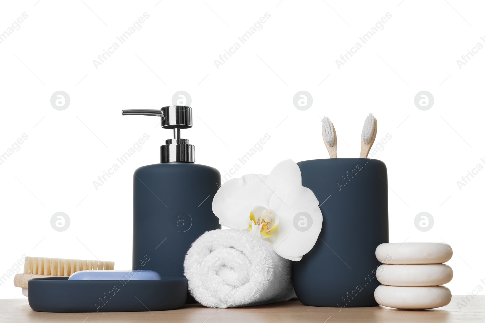 Photo of Bath accessories. Different personal care products and flower on wooden table against white background