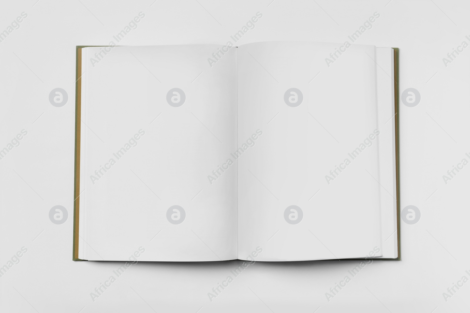 Photo of Open book on white background, top view