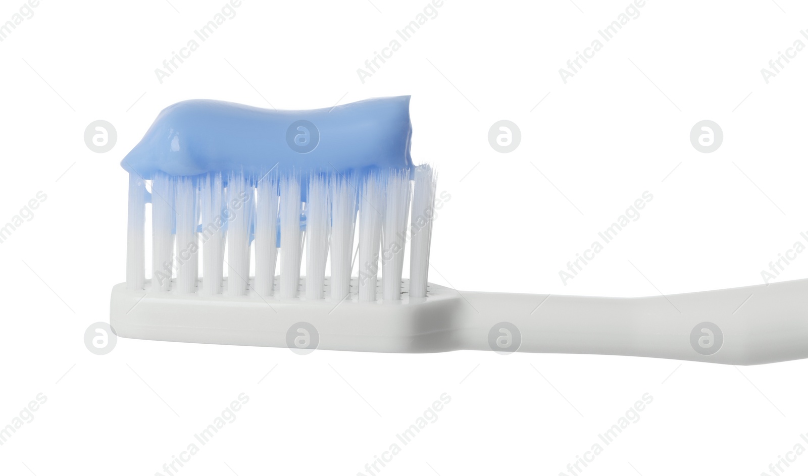 Photo of Plastic toothbrush with paste on white background, closeup