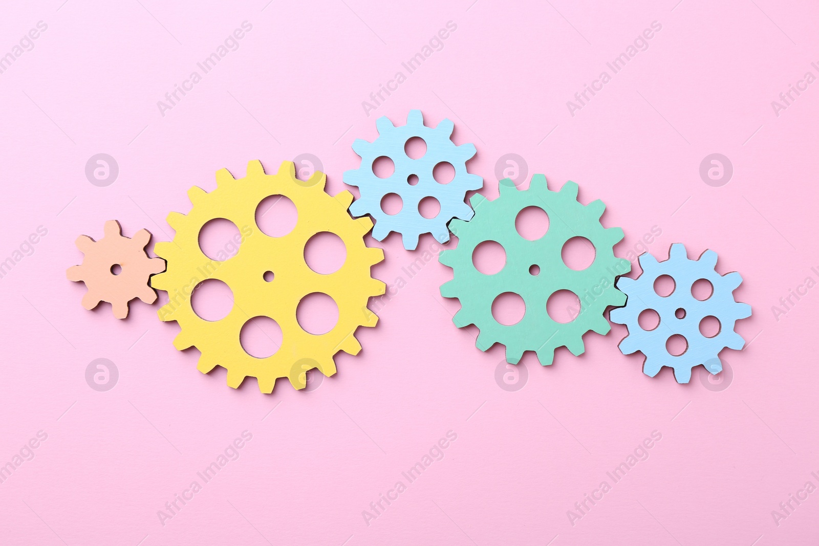 Photo of Business process organization and optimization. Scheme with colorful figures on pink background, top view