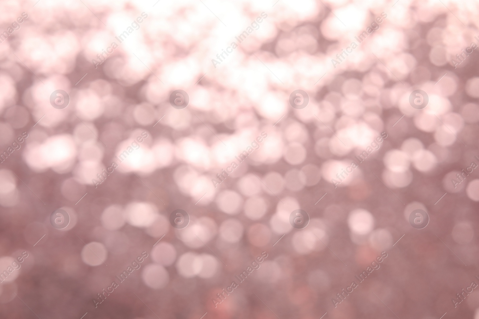 Photo of Blurred view of color glitter as background