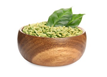 Wooden bowl with green coffee beans and fresh leaves on white background