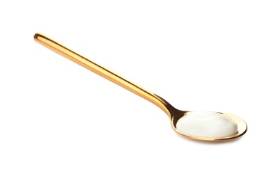 Photo of Spoon with yummy yogurt on white background