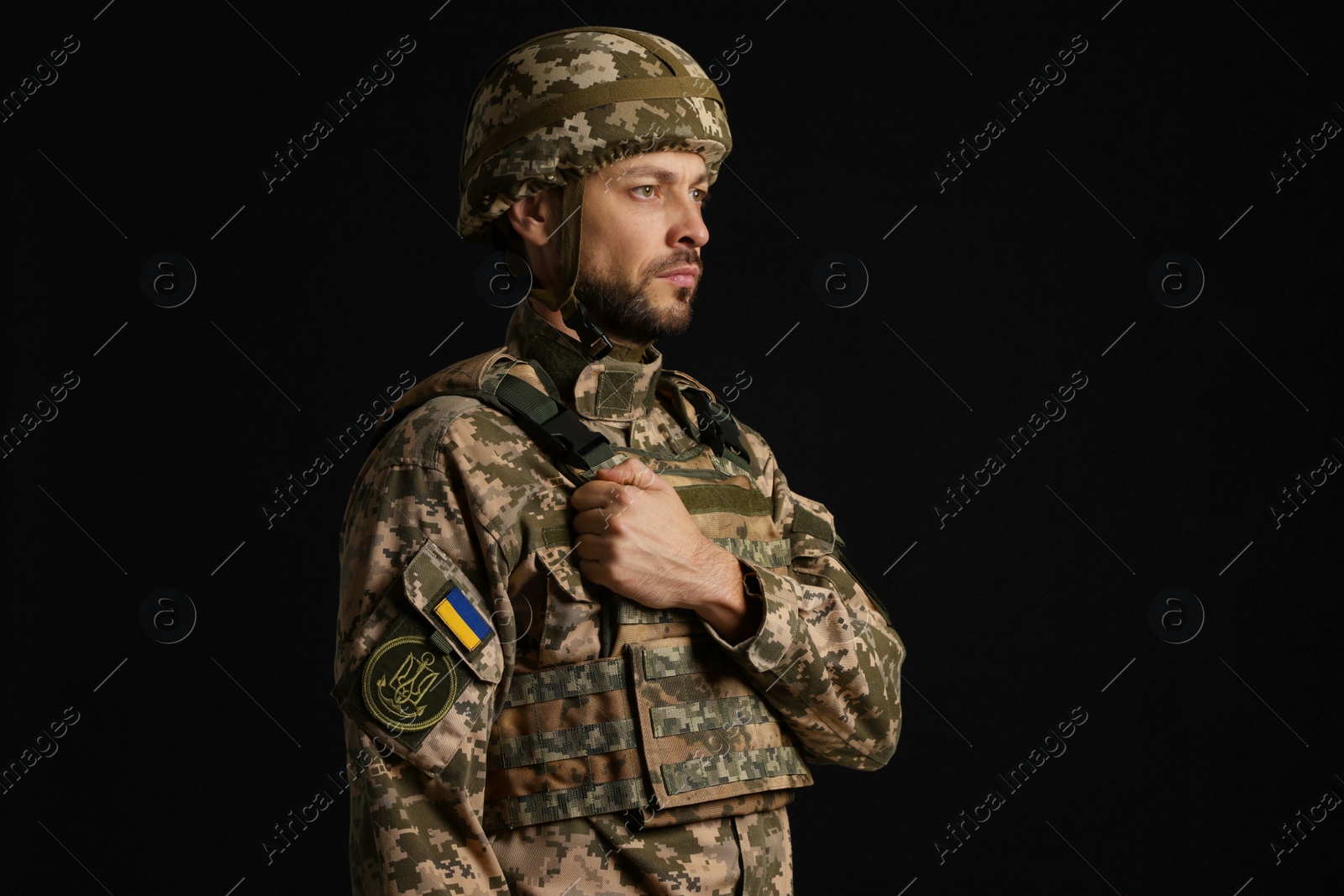 Photo of Soldier in Ukrainian military uniform on black background