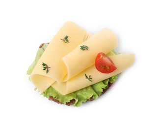 Photo of Tasty sandwich with slices of fresh cheese, tomato, thyme and lettuce isolated on white, top view
