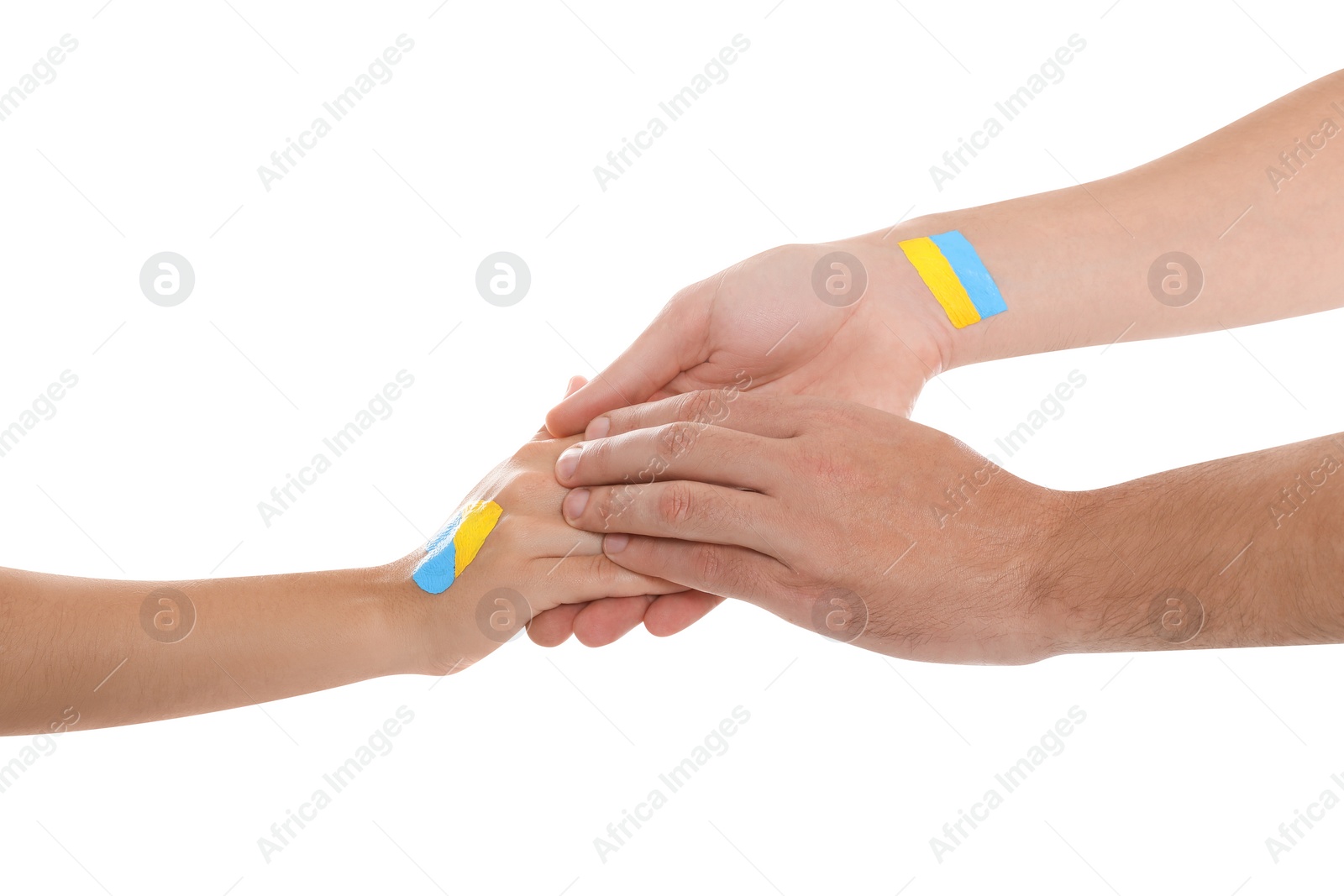 Photo of Man and woman with painted Ukrainian flags on their hands against white background, closeup