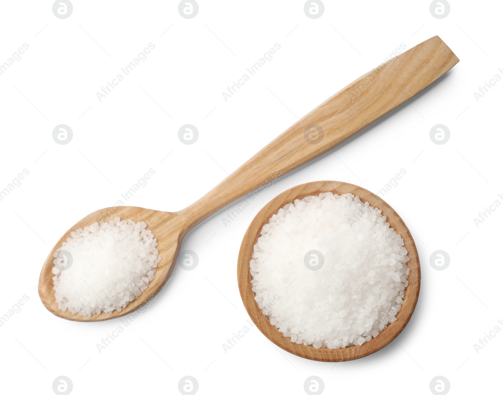 Photo of Natural salt in wooden spoon and bowl isolated on white, top view