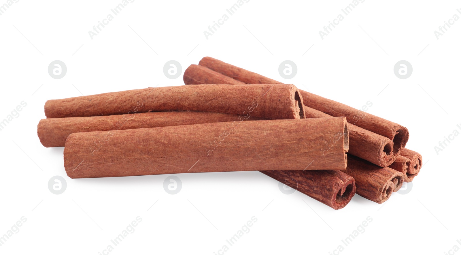 Photo of Dry aromatic cinnamon sticks isolated on white