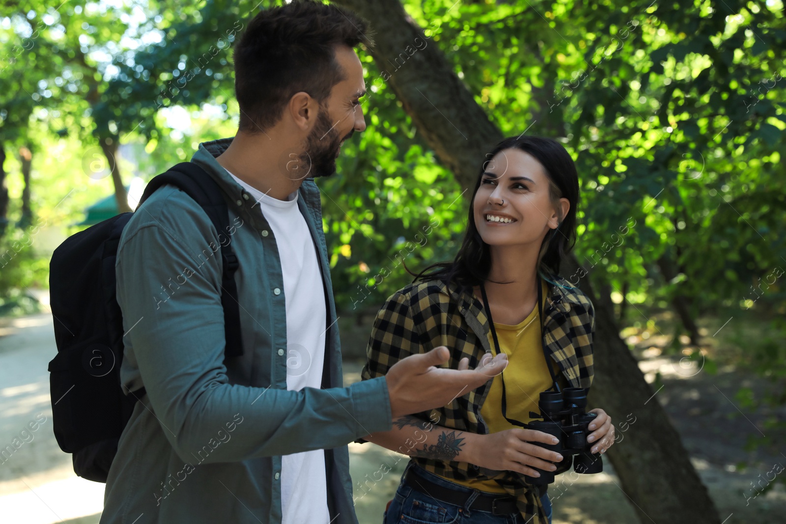 Photo of Lovely couple spending time together in nature reserve