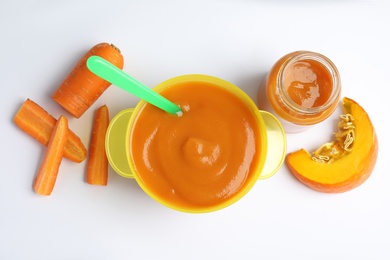 Flat lay composition with healthy baby food and ingredients on white background