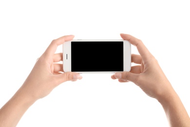 Photo of Woman holding smartphone with blank screen on white background. Mockup for design
