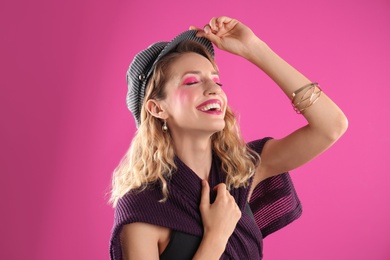 Beautiful young woman posing on color background. Summer fashion