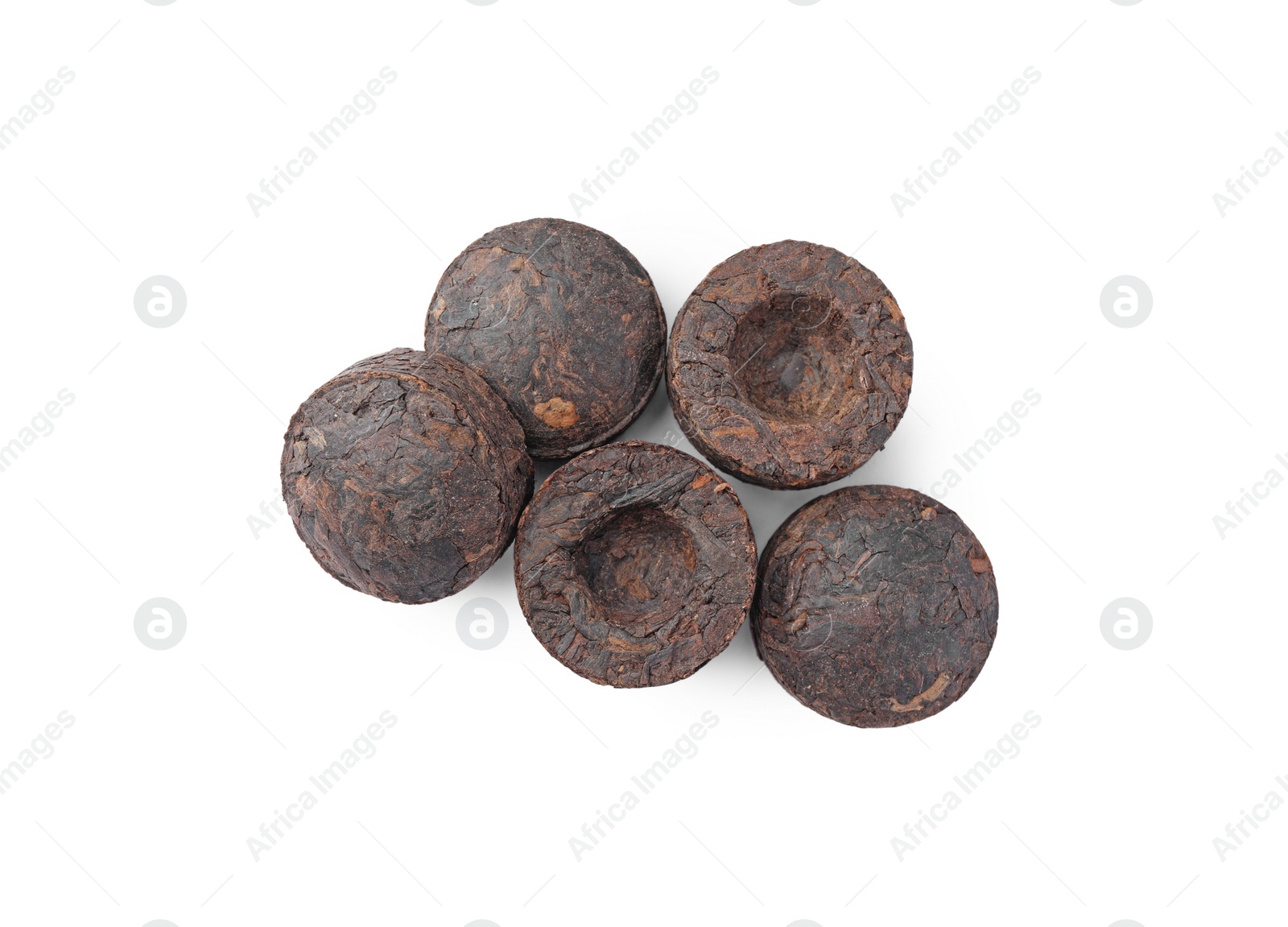 Photo of Cake shaped traditional Chinese pu-erh tea isolated on white, top view
