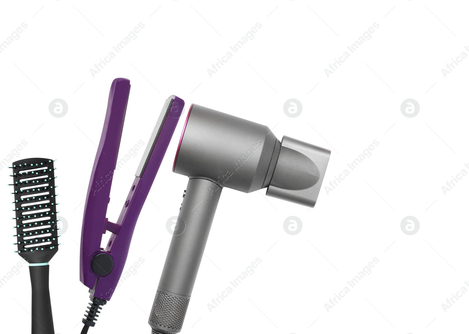 Image of Hair dryer, straightener and brush on white background