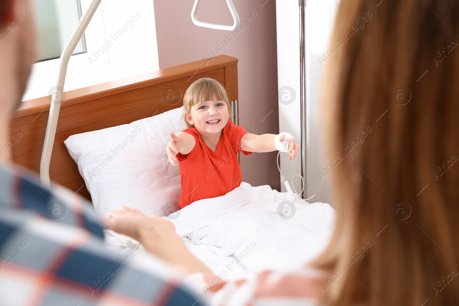 Photo of Parents visiting their little child in hospital