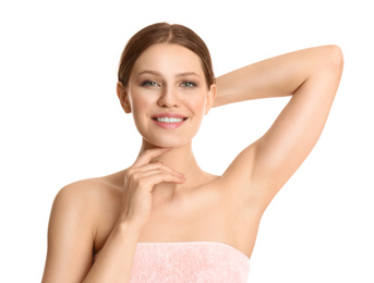 Photo of Young beautiful woman showing armpit with smooth clean skin on white background