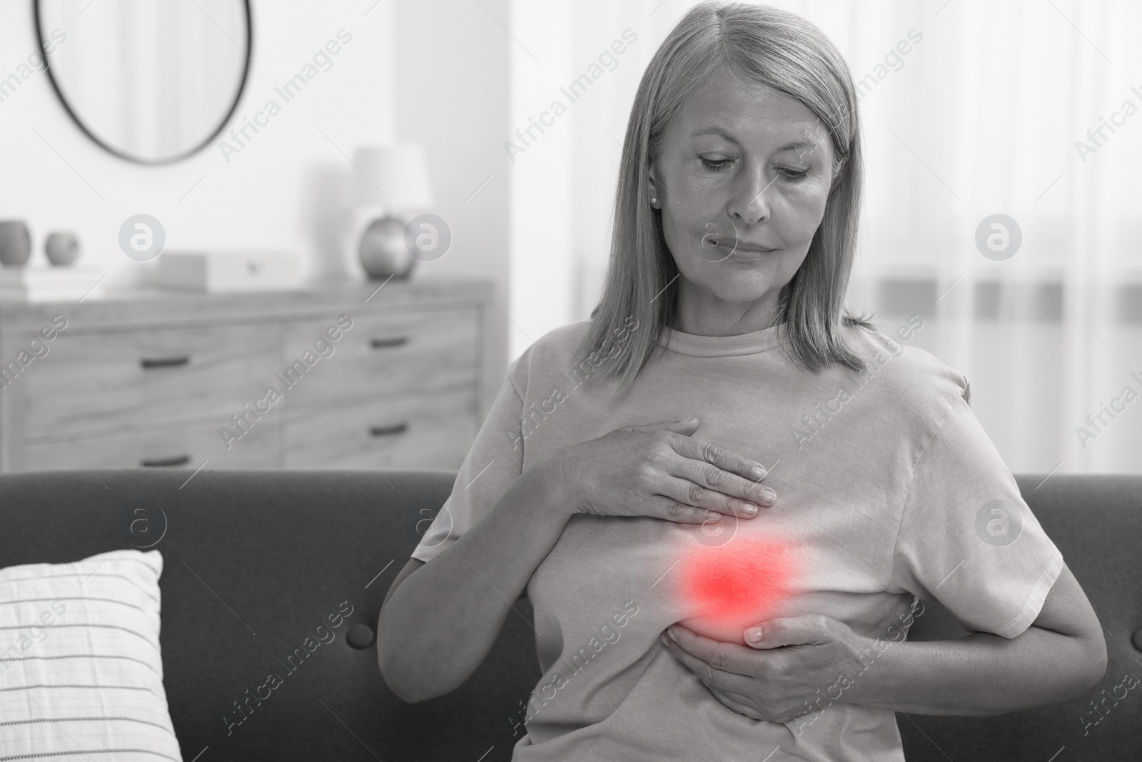 Image of Beautiful senior woman doing breast self-examination at home, space for text. Color accent effect