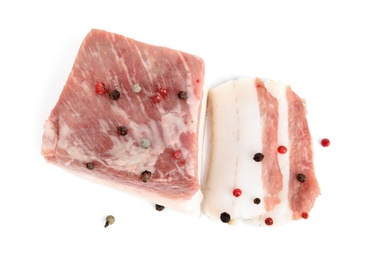 Photo of Cut pork fatback with pepper isolated on white, top view