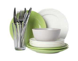 Set of beautiful ceramic dishware, glass and cutlery isolated on white