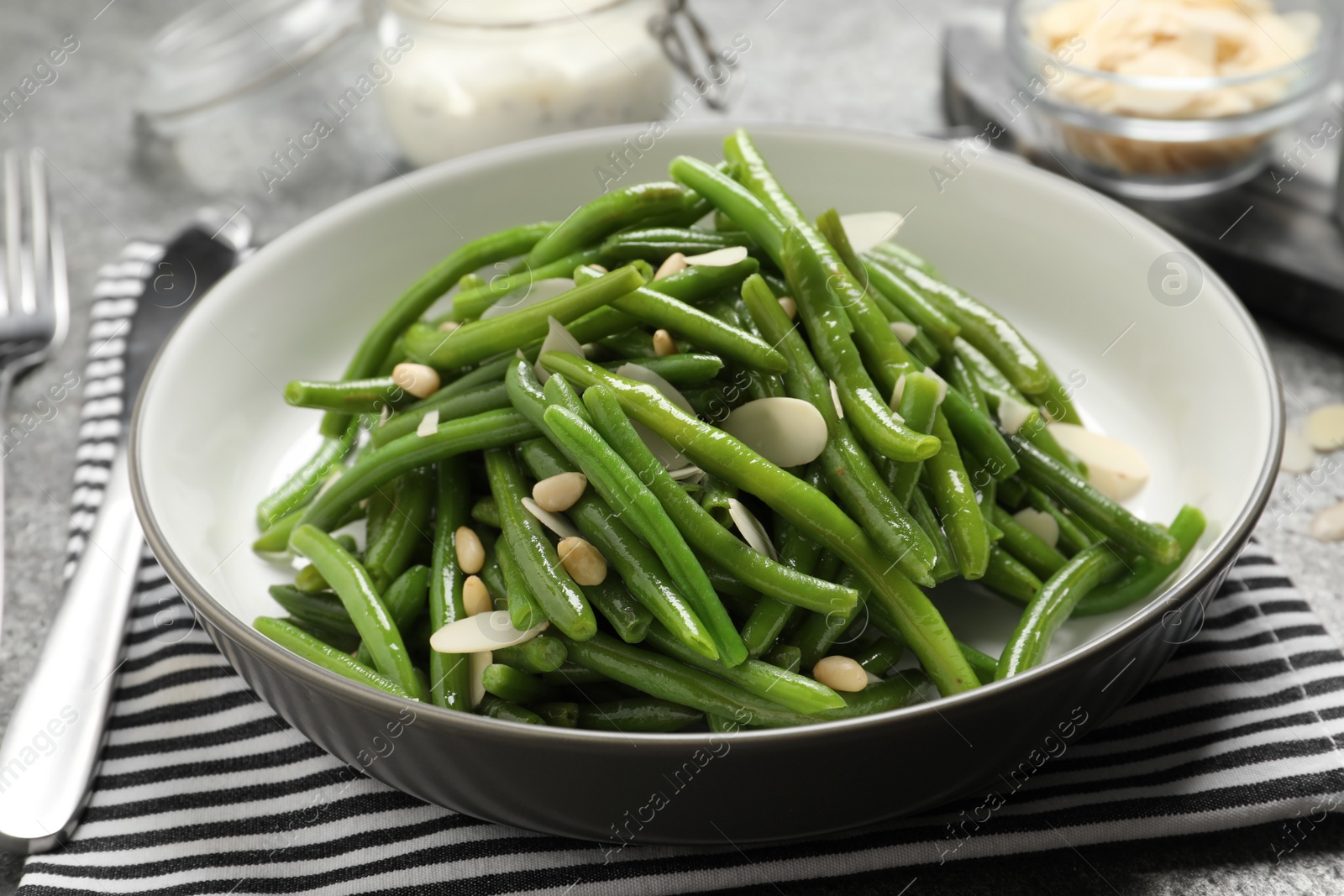 Photo of Tasty salad with green beans served on table